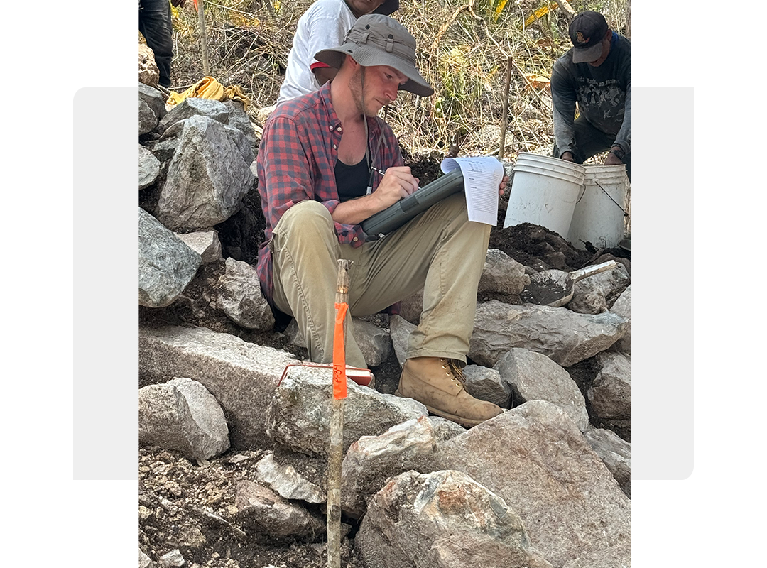 A student taking notes on field research